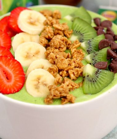 This Banana Kiwi Green Smoothie Bowl is the perfect way to jump start your mornings. Filled with bananas, kiwi, mango and spinach, this healthy bowl is packed with protein and nutrition. You can eat your morning smoothie and start out the day in a delicious way!