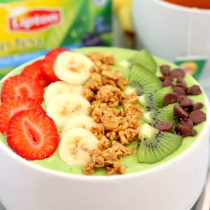 This Banana Kiwi Green Smoothie Bowl is the perfect way to jump start your mornings. Filled with bananas, kiwi, mango and spinach, this healthy bowl is packed with protein and nutrition. You can eat your morning smoothie and start out the day in a delicious way!