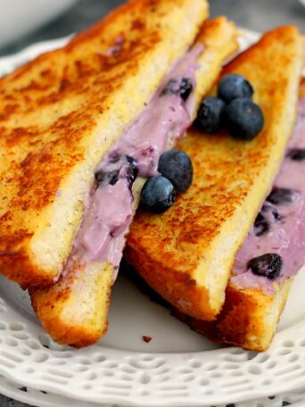 This Blueberry Cheesecake Stuffed French Toast is filled with a sweet cream cheese mixture and then baked until golden. It's simple to prepare and makes an indulgent breakfast that will wow your taste buds!