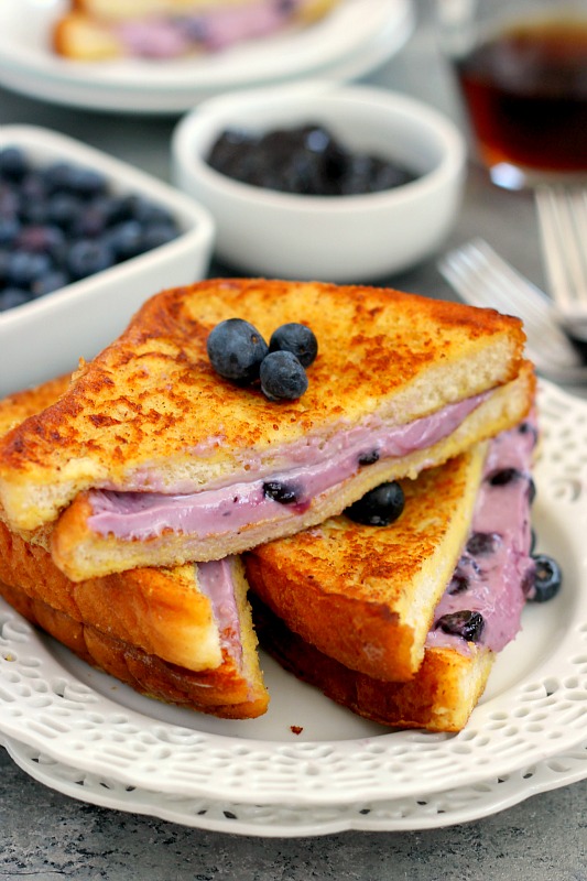 This Blueberry Cheesecake Stuffed French Toast is filled with a sweet cream cheese mixture and then baked until golden. It's simple to prepare and makes an indulgent breakfast that will wow your taste buds!