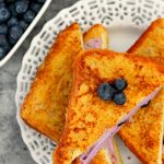 This Blueberry Cheesecake Stuffed French Toast is filled with a sweet cream cheese mixture and then baked until golden. It's simple to prepare and makes an indulgent breakfast that will wow your taste buds!