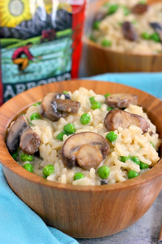 These Creamy Parmesan, Mushroom and Pea Risotto Bowls are filled with nourishing ingredients for an easy and healthier meal. Packed with Parmesan cheese, fresh mushrooms and peas, these bowls provide comfort food at its finest!