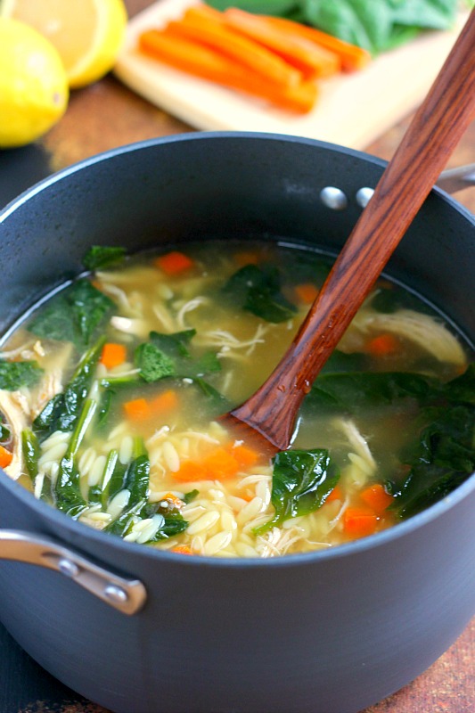 A large pot full of lemon orzo soup. 