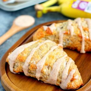 These Banana Bread Scones with Cinnamon Cream Cheese Glaze are crispy on the outside and tender on the inside. The scones are drizzled with a sweet glaze, which makes these treats perfect for breakfast, dessert, or a mid-morning snack!