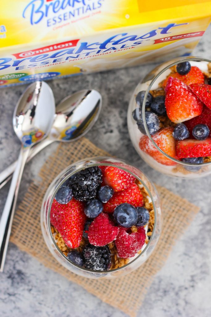 Overhead view of two glasses of breakfast parfaits. 