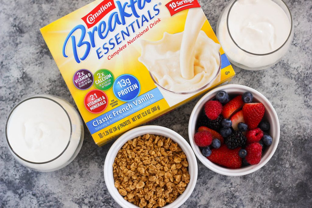 Overhead view of the ingredients needed to make a fruit yogurt parfait recipe. 