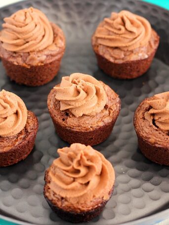 These Brownie Bites with Nutella Frosting are thick, fudgy, and chewy. Topped with a creamy Nutella frosting and made in bite-sized form, these make the ultimate treat!