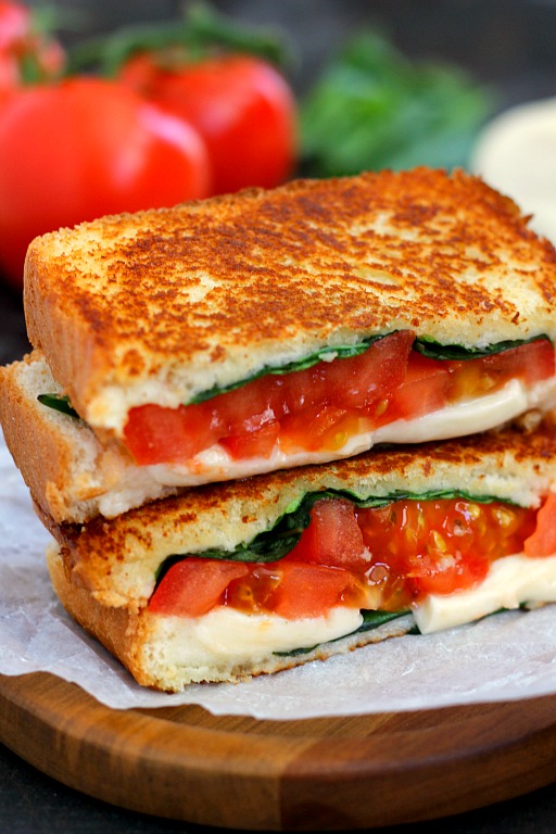 A caprese grilled cheese that's been sliced in half and stacked on itself. 