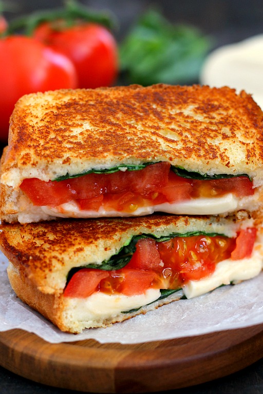 A caprese grilled cheese that's been sliced in half and stacked on itself. 