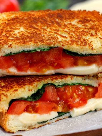 This Caprese Grilled Cheese is filled with fresh basil, creamy mozzarella cheese, and juicy tomatoes. It's a unique twist on a classic sandwich that is packed with flavor and easy to prepare!