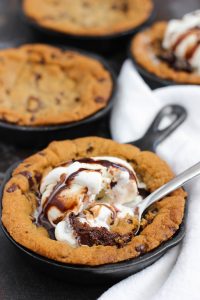 fudgy skillet cookie with a spoon
