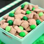 Mint Brownie Muddy Buddies make the most deliciously, decadent snack! Chex cereal is coated in creamy mint chocolate, and then tossed with brownie mix. It creates an irresistible treat that's perfect to serve for St. Patrick's Day, or any other time when you need a chocolate fix!