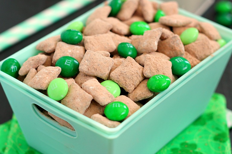 Mint Brownie Muddy Buddies make the most deliciously, decadent snack! Chex cereal is coated in creamy mint chocolate, and then tossed with brownie mix. It creates an irresistible treat that's perfect to serve for St. Patrick's Day, or any other time when you need a chocolate fix!