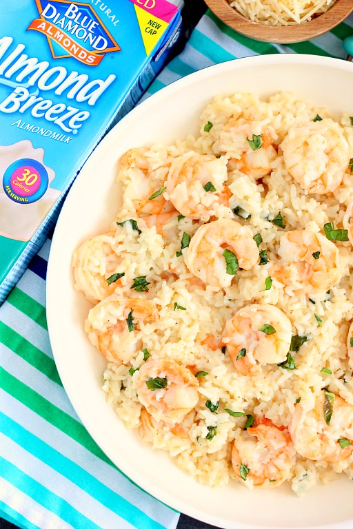 This Parmesan Basil Shrimp and Rice is packed with tender shrimp and fluffy white rice, enveloped with a Parmesan and basil cream sauce. It's easy to make and ready in less than 20 minutes. If you're looking for a new dish for dinner, then this is it!