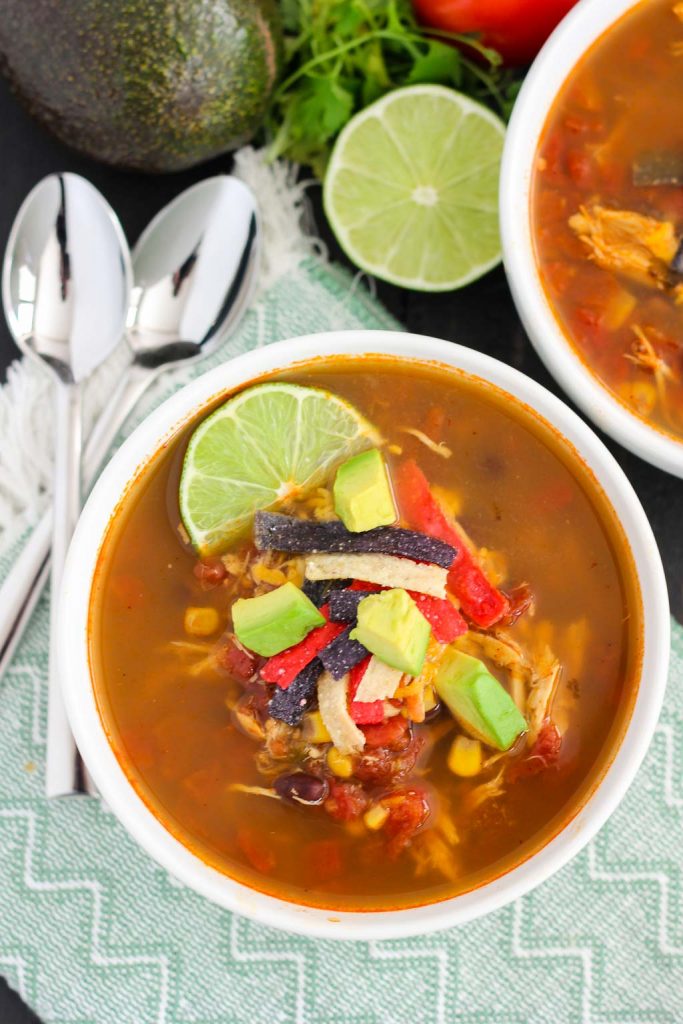 This Slow Cooker Chicken Tortilla Soup is filled with tender chicken, diced tomatoes, corn, black beans, and a combination of spices. With hardly any prep work involved, this flavorful meal will quickly become a household favorite!