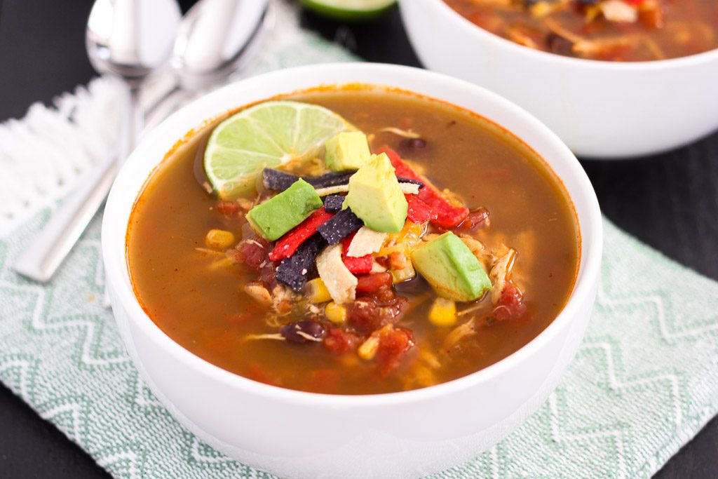 This Slow Cooker Chicken Tortilla Soup is filled with tender chicken, diced tomatoes, corn, black beans, and a combination of spices. With hardly any prep work involved, this flavorful meal will quickly become a household favorite!