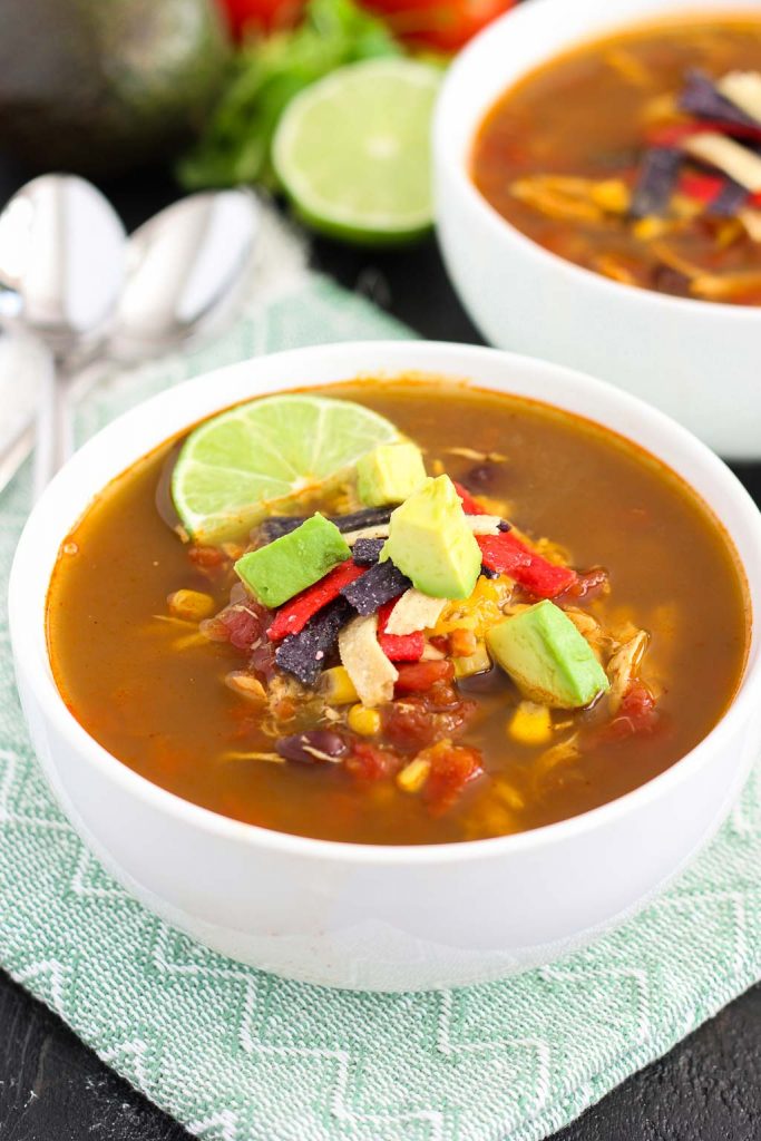 This Slow Cooker Chicken Tortilla Soup is filled with tender chicken, diced tomatoes, corn, black beans, and a combination of spices. With hardly any prep work involved, this flavorful meal will quickly become a household favorite!