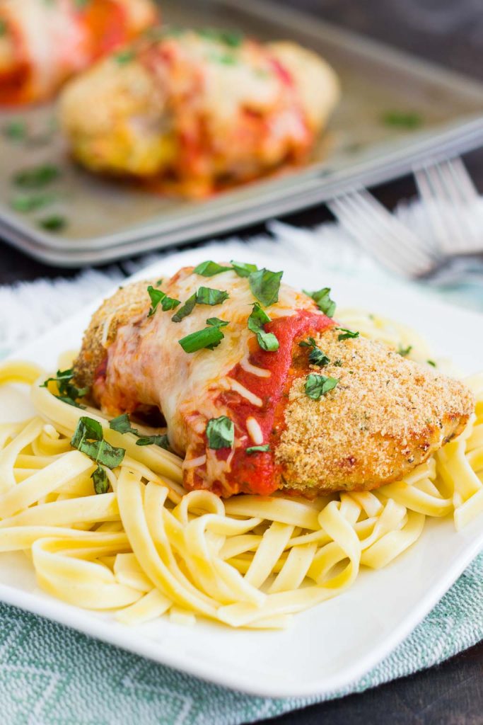 This Baked Chicken Parmesan is coated with a crispy, seasoned crust and baked to perfection. Topped with a rich sauce and mozzarella cheese, this easy meal is perfect for busy weeknights and will be your new favorite dish!