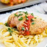 This Baked Chicken Parmesan is coated with a crispy, seasoned crust and baked to perfection. Topped with a rich sauce and mozzarella cheese, this easy meal is perfect for busy weeknights and will be your new favorite dish!