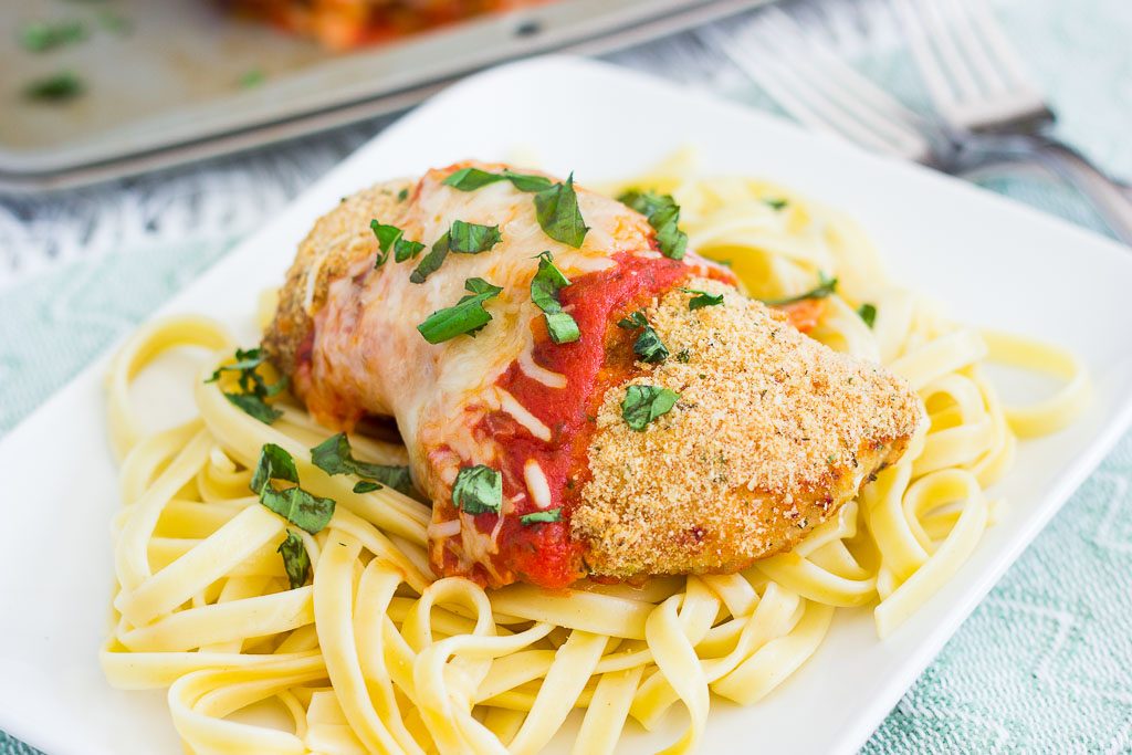 This Baked Chicken Parmesan is coated with a crispy, seasoned crust and baked to perfection. Topped with a rich sauce and mozzarella cheese, this easy meal is perfect for busy weeknights and will be your new favorite dish!