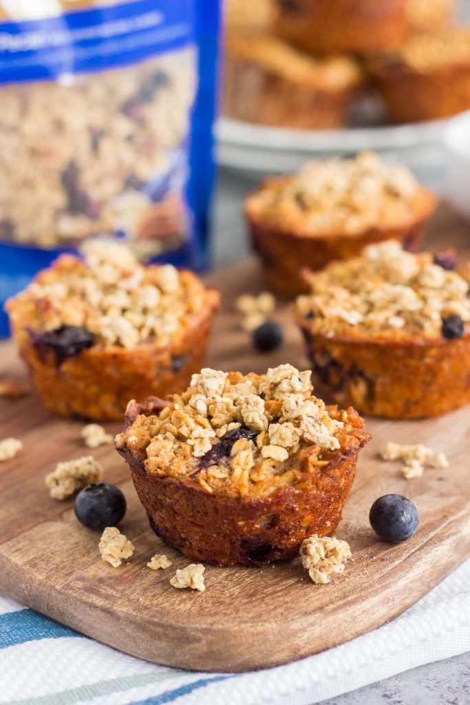 These Blueberry Granola Oatmeal Muffins are packed with hearty oats, fresh blueberries, and topped with sweet granola. Crunchy on the outside and soft on the inside, this simple breakfast can be prepped the night before and made in the morning. These muffins make the most deliciously easy on-the-go breakfast or snack!