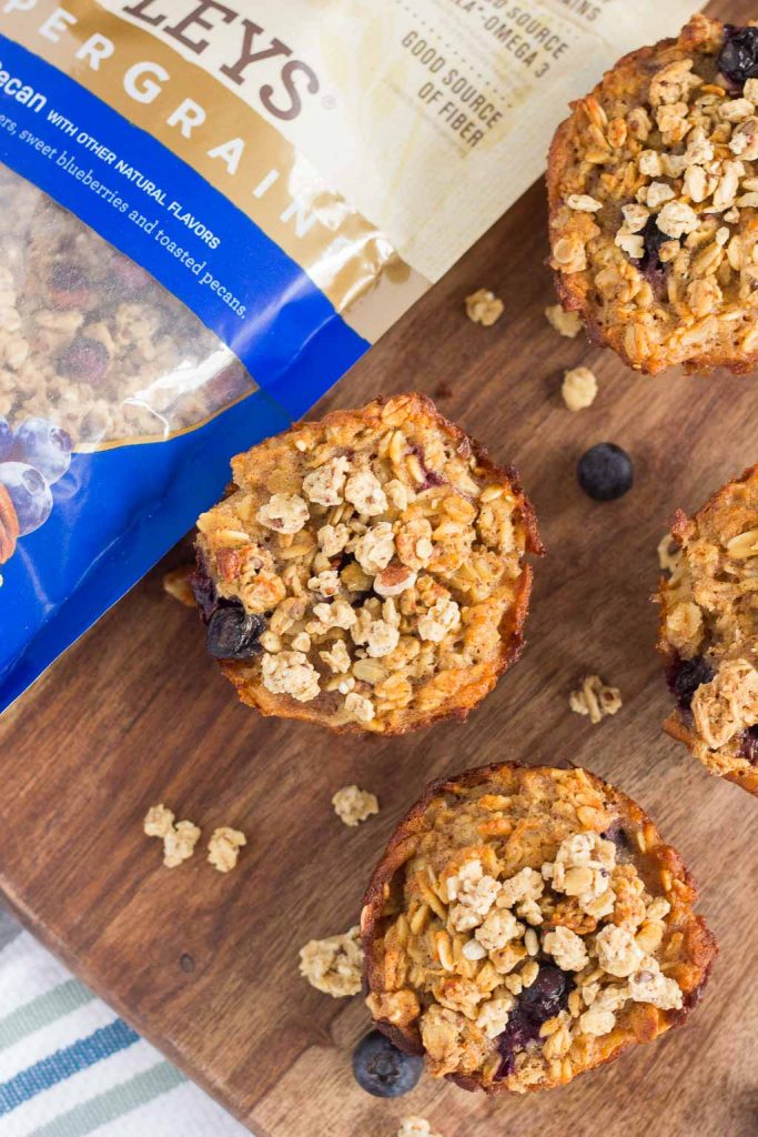 These Blueberry Granola Oatmeal Muffins are packed with hearty oats, fresh blueberries, and topped with sweet granola. Crunchy on the outside and soft on the inside, this simple breakfast can be prepped the night before and made in the morning. These muffins make the most deliciously easy on-the-go breakfast or snack!