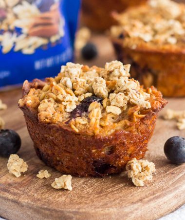 These Blueberry Granola Oatmeal Muffins are packed with hearty oats, fresh blueberries, and topped with sweet granola. Crunchy on the outside and soft on the inside, this simple breakfast can be prepped the night before and made in the morning. These muffins make the most deliciously easy on-the-go breakfast or snack!