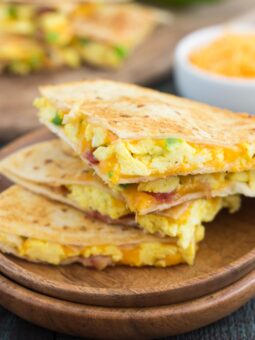 These Easy Breakfast Quesadillas are filled with fluffy, scrambled eggs, green peppers, bacon and cheddar cheeses, all enveloped between two crispy tortilla shells. It's an easy meal that's perfect for busy mornings!
