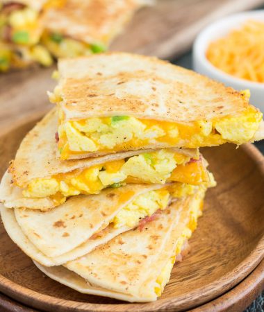 These Easy Breakfast Quesadillas are filled with fluffy, scrambled eggs, green peppers, bacon and cheddar cheeses, all enveloped between two crispy tortilla shells. It's an easy meal that's perfect for busy mornings!