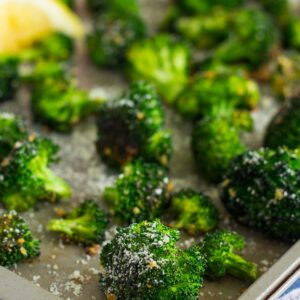 Roasted Garlic Parmesan Broccoli is an easy side dish that's bursting with flavor. Fresh broccoli is tossed with a mixture of garlic and Parmesan cheese, which results in a slightly crisp texture and seasoned to perfection. Prepped and cooked in one pan, you'll have this roasted vegetable ready in no time!