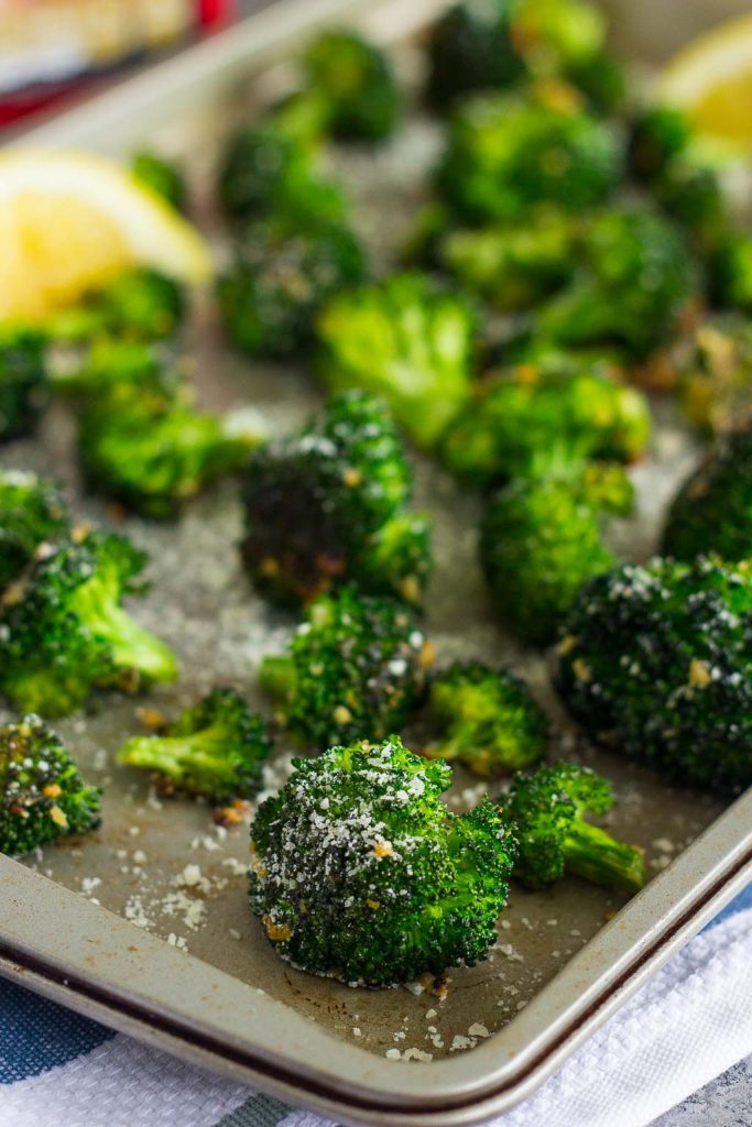 Roasted Garlic Parmesan Broccoli is an easy side dish that's bursting with flavor. Prepped and cooked in one pan, you'll have this roasted vegetable ready in no time! #broccoli #roastedbroccoli #broccolirecipe #vegetables #roastedvegetables #sidedish #easysidedish