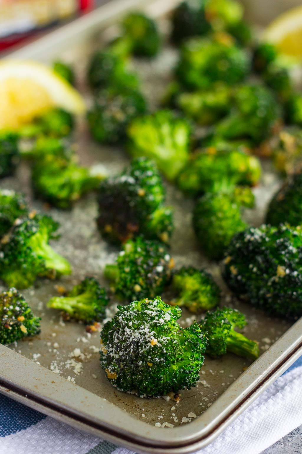 Roasted Garlic Parmesan Broccoli is an easy side dish that's bursting with flavor. Fresh broccoli is tossed with a mixture of garlic and Parmesan cheese, which results in a slightly crisp texture and seasoned to perfection. Prepped and cooked in one pan, you'll have this roasted vegetable ready in no time!