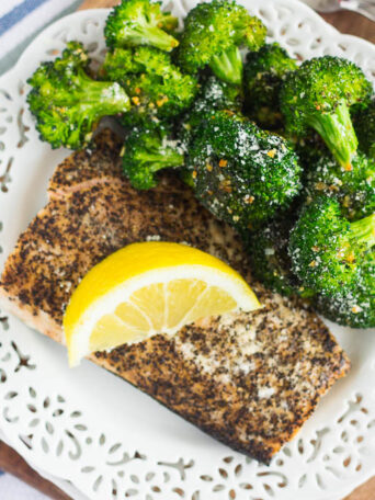 Roasted Garlic Parmesan Broccoli is an easy side dish that's bursting with flavor. Fresh broccoli is tossed with a mixture of garlic and Parmesan cheese, which results in a slightly crisp texture and seasoned to perfection. Prepped and cooked in one pan, you'll have this roasted vegetable ready in no time!