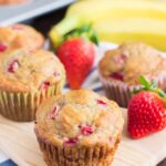 strawberry banana muffins on a cutting board