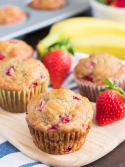 strawberry banana muffins on a cutting board