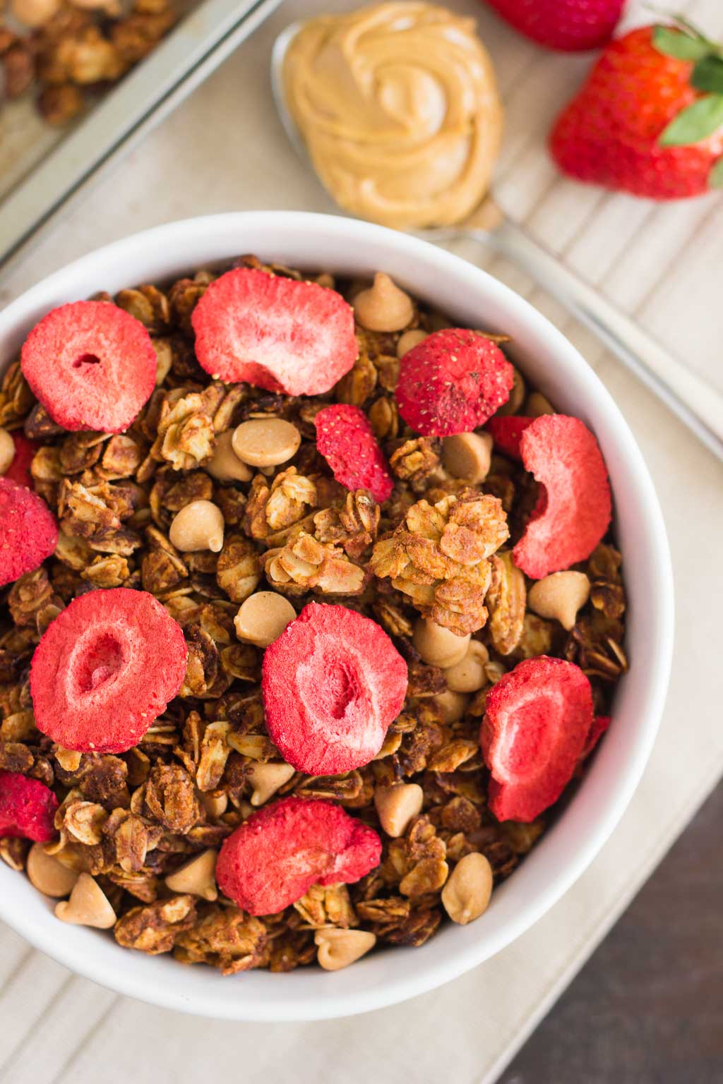 This Strawberry Peanut Butter Granola is packed with crunchy granola clusters, pecans, peanut butter chips, and strawberries. It's an easy treat that makes the perfect breakfast or snack to satisfy your peanut butter cravings!