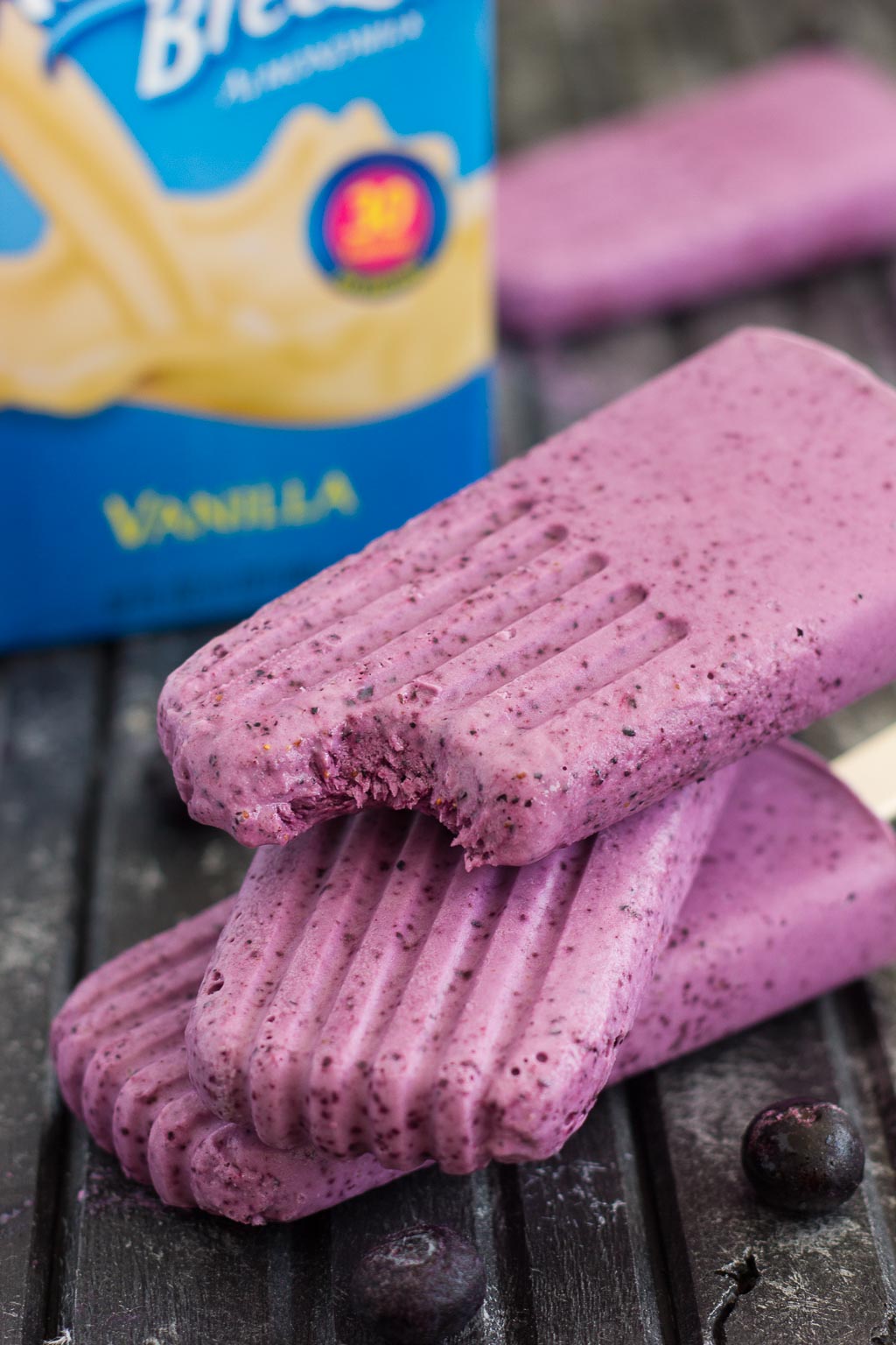 These Blueberry Cheesecake Pops taste like your favorite baked good, in frozen form. Filled with a cream cheese mixture that's studded with blueberries, these pops take just minutes to make and are perfect for cooling off with on a hot, summer day!
