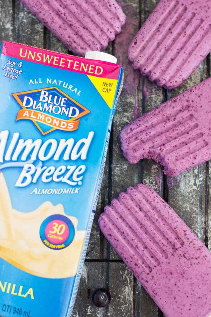 These Blueberry Cheesecake Pops taste like your favorite baked good, in frozen form. Filled with a cream cheese mixture that's studded with blueberries, these pops take just minutes to make and are perfect for cooling off with on a hot, summer day!