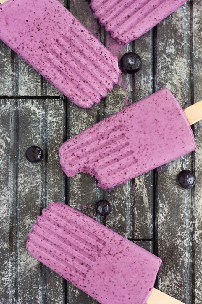 These Blueberry Cheesecake Pops taste like your favorite baked good, in frozen form. Filled with a cream cheese mixture that's studded with blueberries, these pops take just minutes to make and are perfect for cooling off with on a hot, summer day!