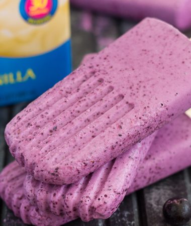 These Blueberry Cheesecake Pops taste like your favorite baked good, in frozen form. Filled with a cream cheese mixture that's studded with blueberries, these pops take just minutes to make and are perfect for cooling off with on a hot, summer day!