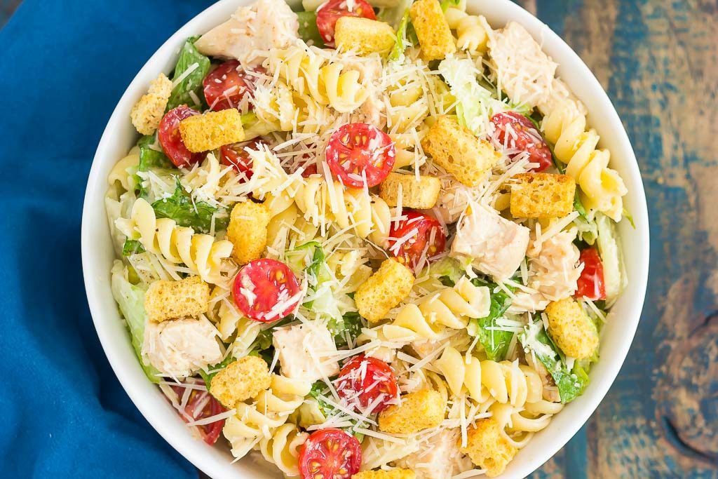 overhead view of a bowl of chicken caesar pasta salad