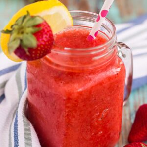 This Frozen Strawberry Lemonade is refreshing blend of sweet strawberries and fresh lemonade. The sweet and tangy flavor is blended to perfection, which results in a cool treat that's made for those hot, summer days!