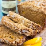 This Glazed Peach Streusel Bread is packed with juicy peaches and topped with a cinnamon crumble and sweet vanilla glaze. You'll fall in love with the soft and fluffy texture and deliciously sweet flavor!