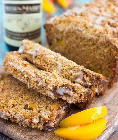 This Glazed Peach Streusel Bread is packed with juicy peaches and topped with a cinnamon crumble and sweet vanilla glaze. You'll fall in love with the soft and fluffy texture and deliciously sweet flavor!