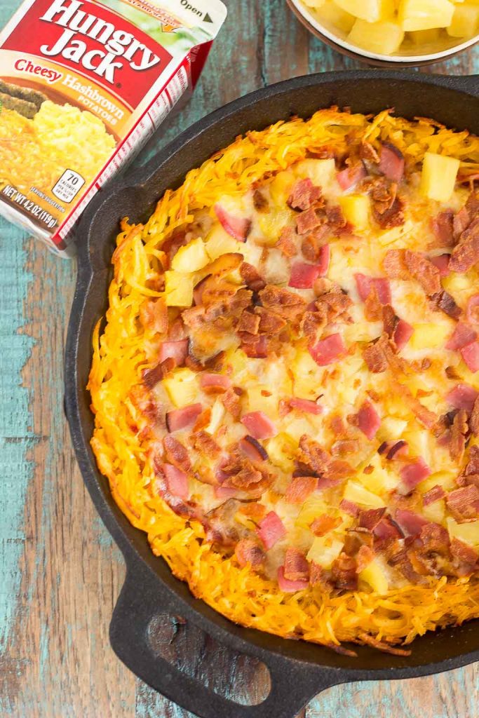 Put a spin on pizza night with hashbrowns for dinner! This Hawaiian Pizza with Hashbrown Crust features a cheesy, crispy hashbrown crust that's loaded with two types of meat, pineapple chunks, and melted, mozzarella cheese. Easy to make and full of flavor, this pizza will be your new favorite dish!