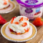 These Mini Strawberry Peanut Butter Cheesecake Pies are filled with Dannon® Light & Fit® Strawberry Cheesecake Greek Yogurt, creamy peanut butter, and fresh strawberries. Easy to make and packed with flavor, you can enjoy this no-bake, simple dessert that's perfect for the warmer weather!