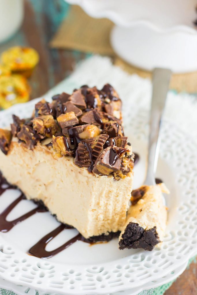 This No-Bake Peanut Butter Cheesecake has an Oreo peanut butter cookie crust, a creamy peanut butter filling, and chopped peanut butter cups on top!