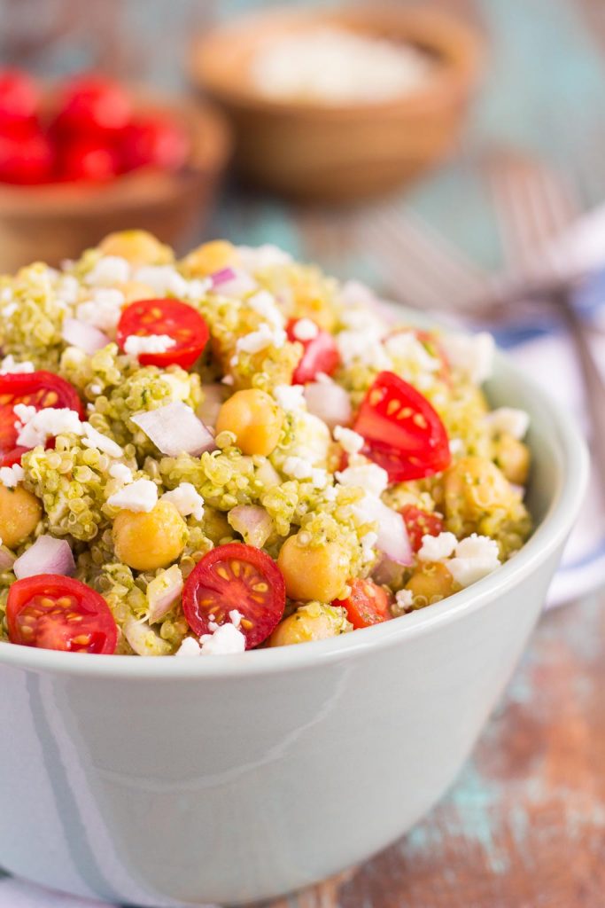 This Quinoa and Chickpea Pesto Salad is filled with chickpeas, hearty quinoa, cherry tomatoes, red onions, and crumbled feta cheese. It's tossed with a zesty pesto sauce that packs a punch of flavor in every bite. It's easy to prepare and makes simple dish that's perfect for lunch or dinner!