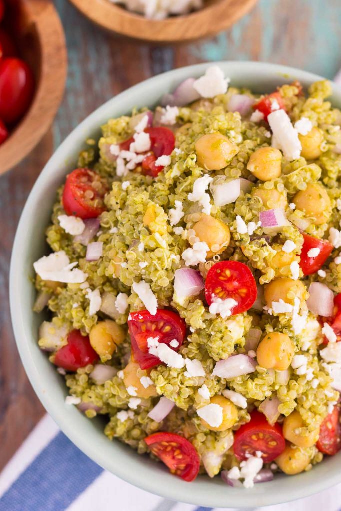 This Quinoa and Chickpea Pesto Salad is filled with chickpeas, hearty quinoa, cherry tomatoes, red onions, and crumbled feta cheese. It's tossed with a zesty pesto sauce that packs a punch of flavor in every bite. It's easy to prepare and makes simple dish that's perfect for lunch or dinner!