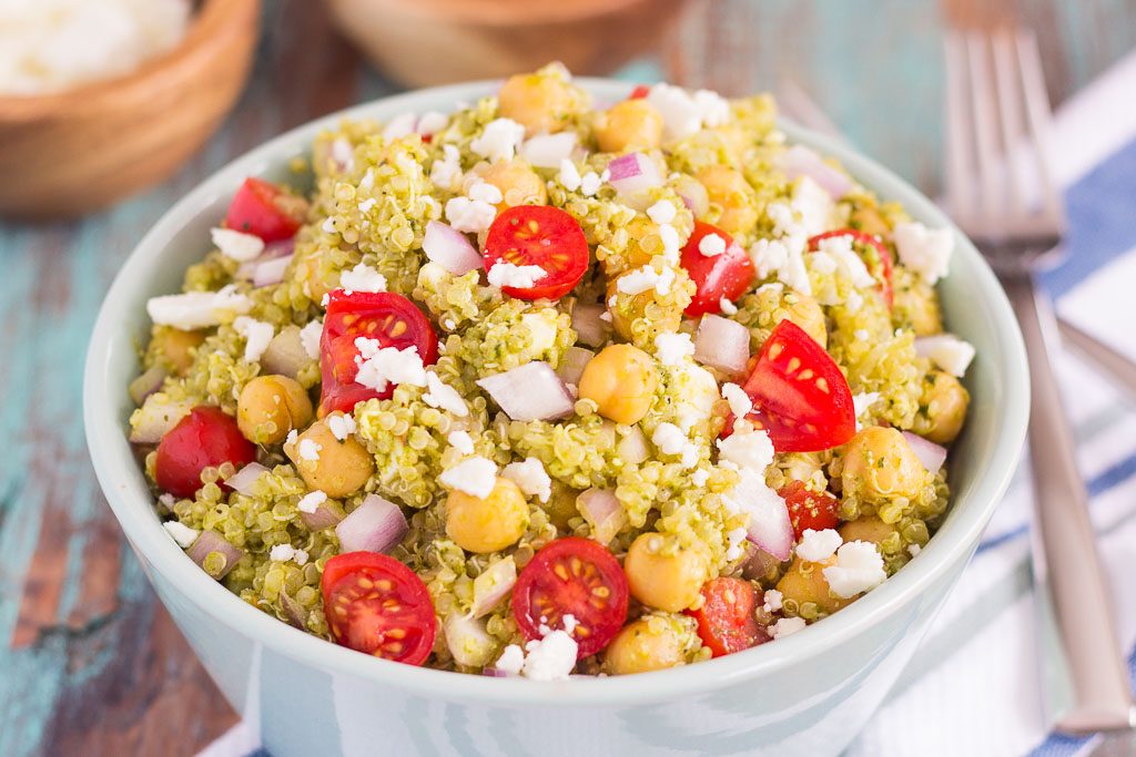 This Quinoa and Chickpea Pesto Salad is filled with chickpeas, hearty quinoa, cherry tomatoes, red onions, and crumbled feta cheese. It's tossed with a zesty pesto sauce that packs a punch of flavor in every bite. It's easy to prepare and makes simple dish that's perfect for lunch or dinner!